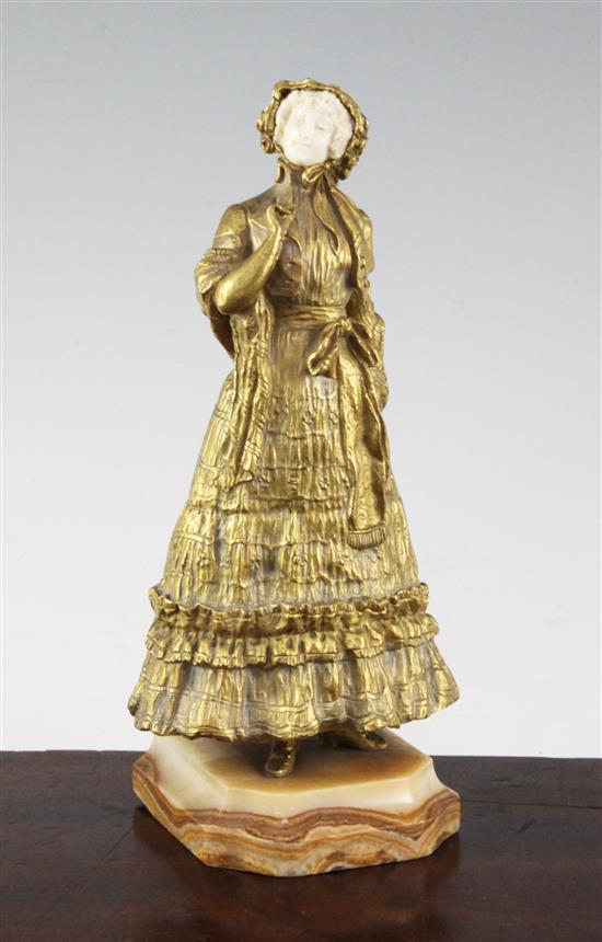 Rene Paul Marquet (French, 1879-1939). A gilt bronze and ivory figure of a lady wearing a bonnet, 10.25in.